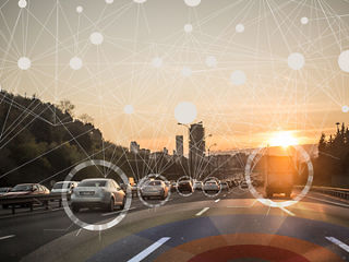 Connected vehicles on highway with overlay of NTN network lines. 