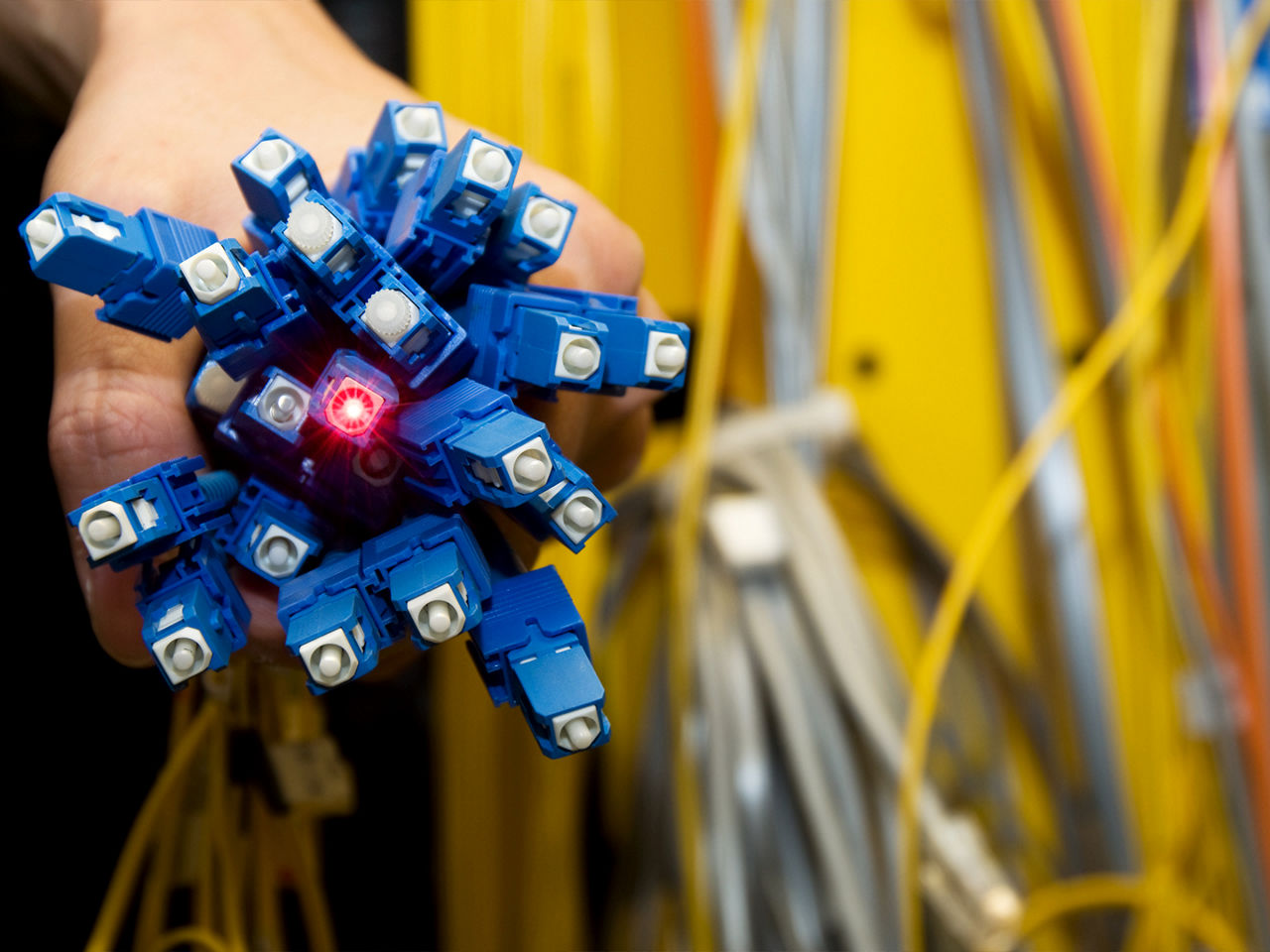 Electrical technician installing a modular fiber optic system. 