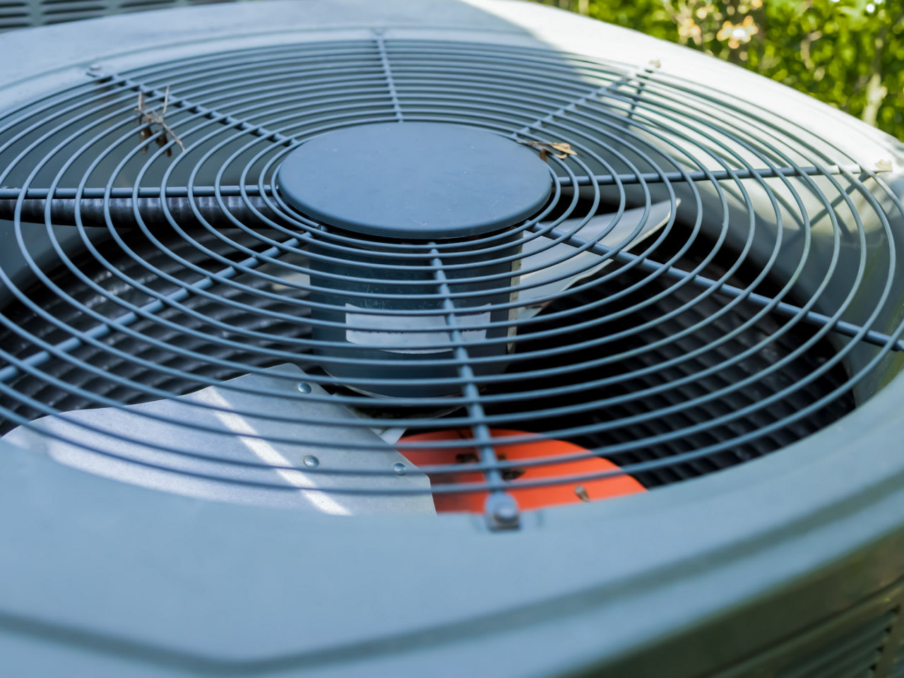 Close-up of an outdoor HVAC unit fan system. 