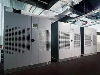 A row of Uninterruptible Power Supply (UPS) units. 