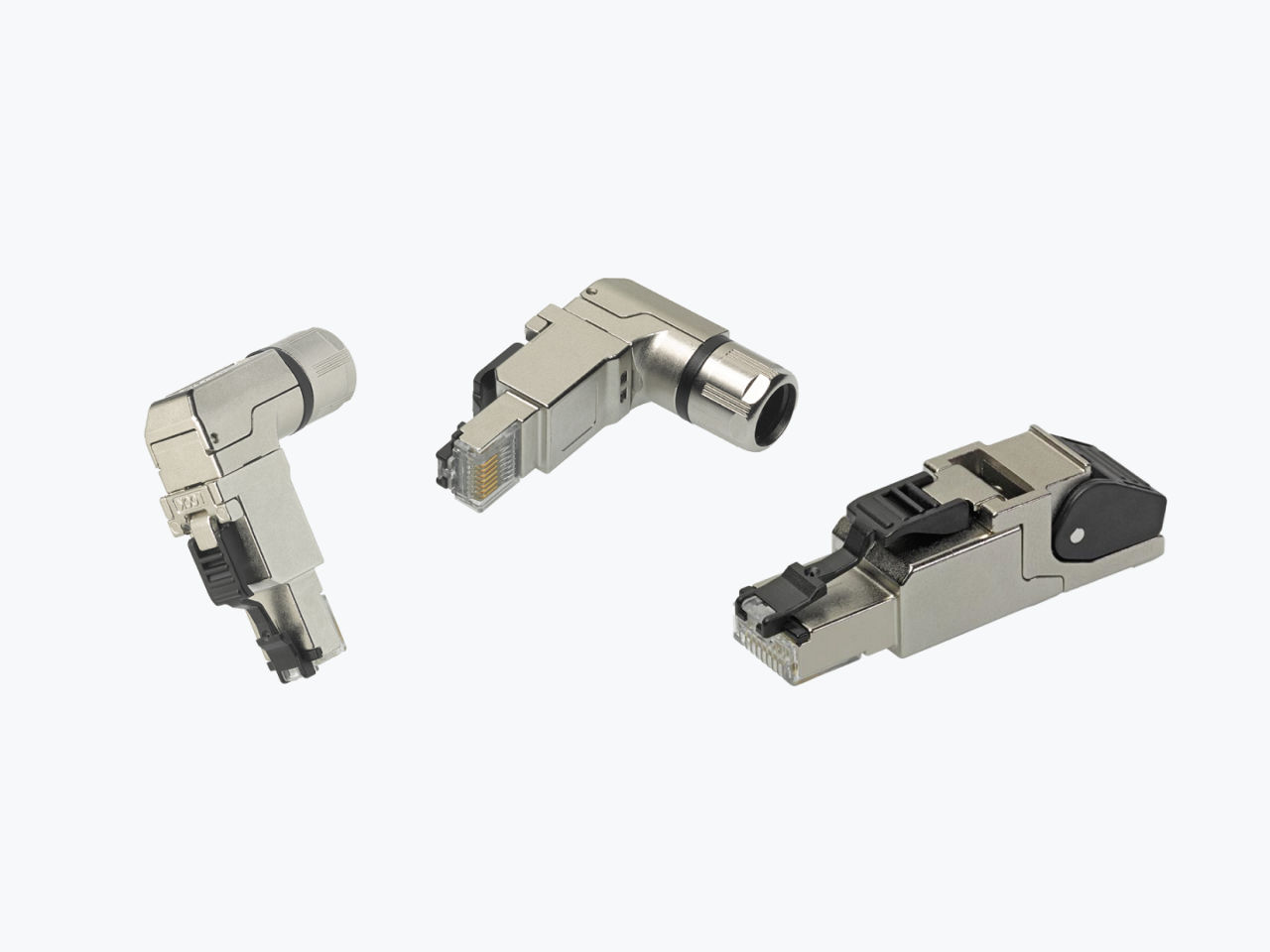 Close-up of three angled RJ45 shielded connectors. 