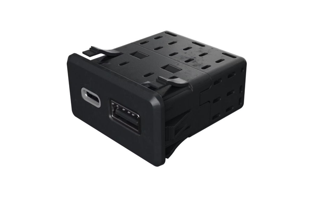 In-vehicle dual port smart charger with USB Type A and USB Type C ports.